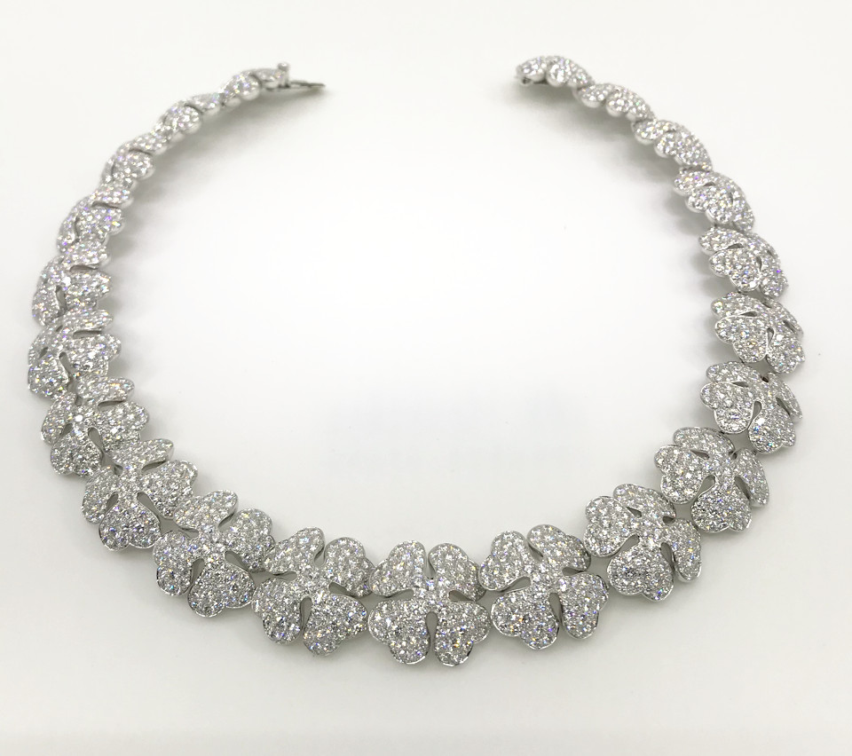 A RETRO 'DEAR' FOUR LEAF CLOVER CHARM NECKLACE, BY CARTIER, CIRCA 1950S —  Revival Jewels